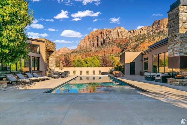 1203 Canyon Springs Rd, Springdale, UT 84767 - view of swimming pool with a patio, a mountain view, and an outdoor living space
