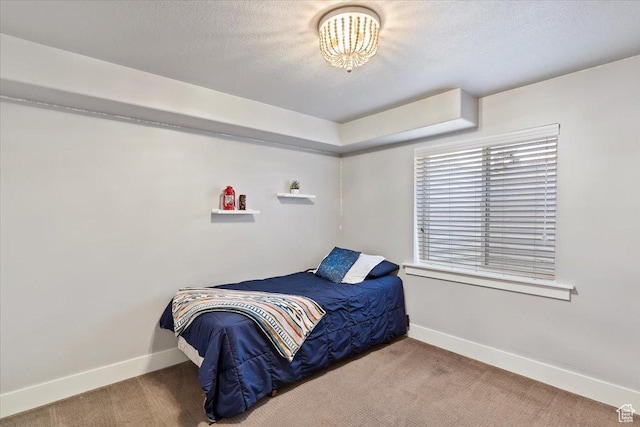 5707 Scenic Ln, Mountain Green, UT 84050 - carpeted bedroom featuring baseboards, a textured ceiling, and a chandelier