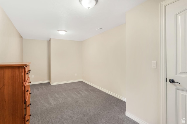 basement featuring carpet flooring and baseboards