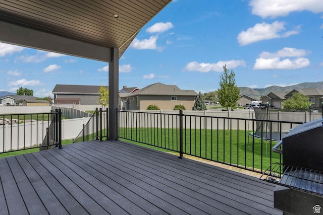 wooden terrace featuring a residential view