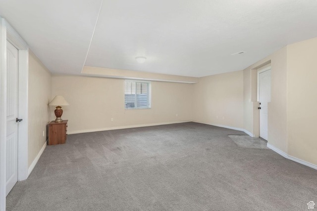 below grade area with carpet and baseboards