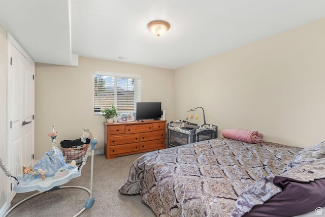 bedroom featuring carpet flooring and baseboards