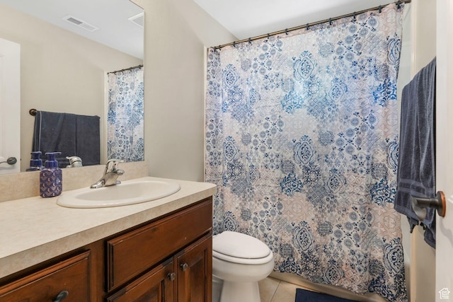bathroom with tile patterned flooring, toilet, vanity, and a shower with curtain