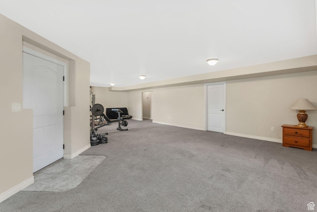 finished basement featuring carpet and baseboards