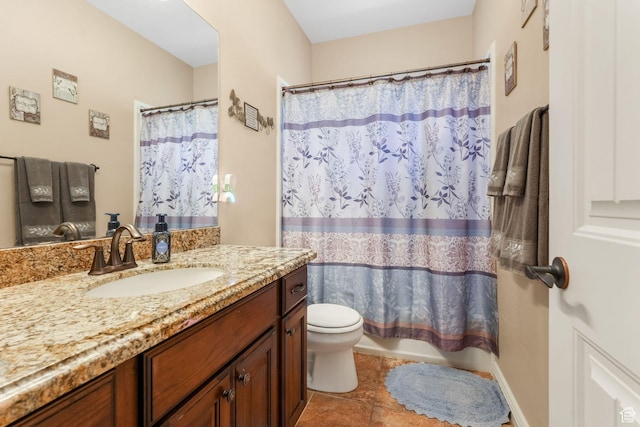 bathroom with toilet, vanity, tile patterned flooring, and shower / bath combo