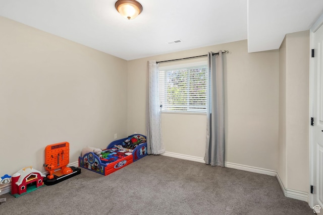 unfurnished bedroom with carpet flooring and baseboards