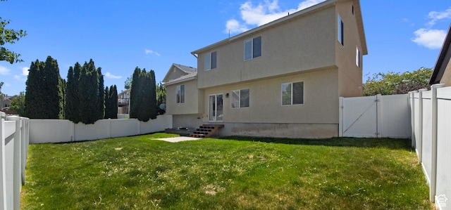 back of property featuring a gate, stucco siding, and entry steps