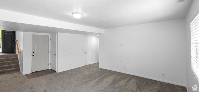 unfurnished bedroom with carpet and baseboards