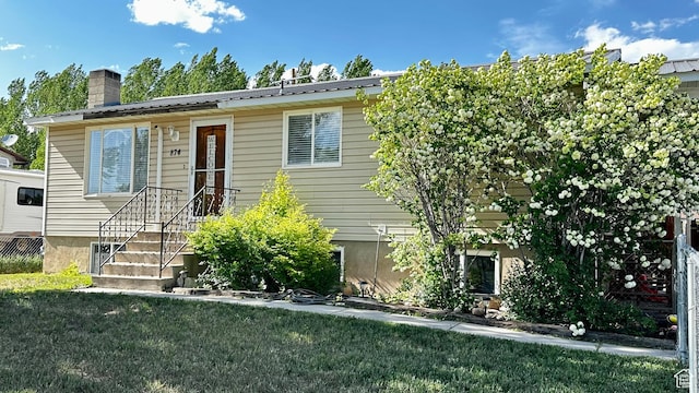 874 W 300 S, Vernal, UT 84078 - view of front facade featuring a front yard and a chimney