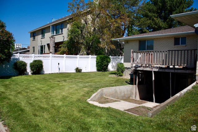 view of yard featuring a wooden deck