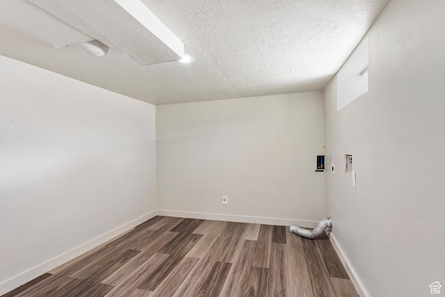 41 N 400 E, Brigham City, UT 84302 - clothes washing area with wood finished floors, baseboards, washer hookup, and a textured ceiling