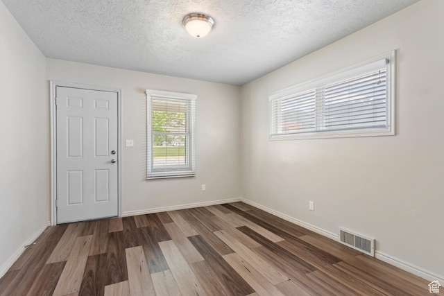 41 N 400 E, Brigham City, UT 84302 - unfurnished room with wood finished floors, a textured ceiling, and baseboards