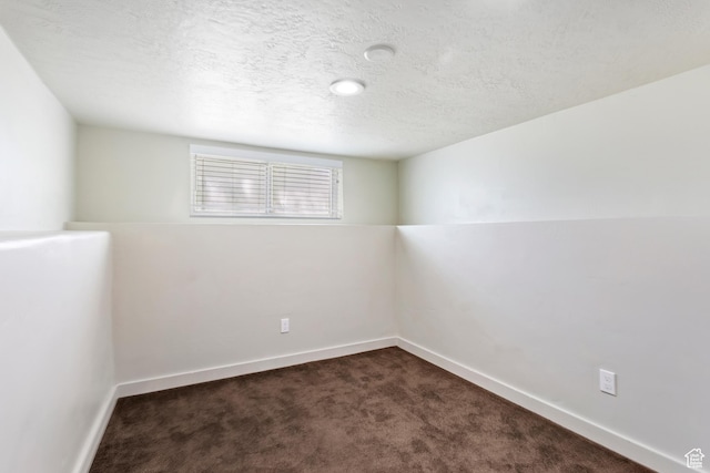 41 N 400 E, Brigham City, UT 84302 - empty room with dark colored carpet, baseboards, and a textured ceiling
