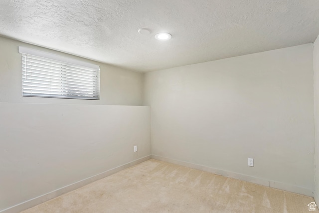 41 N 400 E, Brigham City, UT 84302 - unfurnished room with light colored carpet, a textured ceiling, baseboards, and recessed lighting