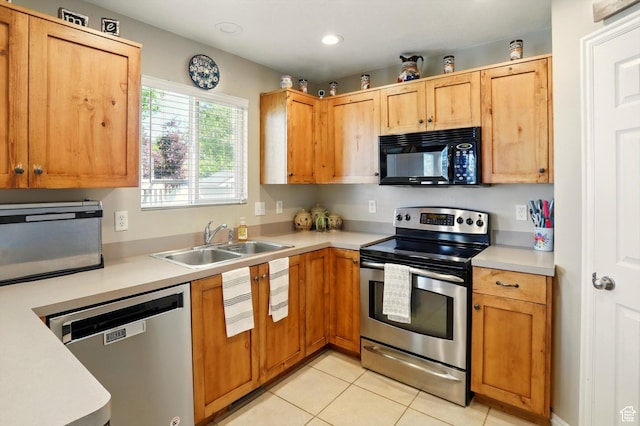 1424 W 3325 S, Perry, UT 84302 - kitchen featuring appliances with stainless steel finishes, a sink, light countertops, light tile patterned floors, and recessed lighting