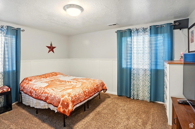 1424 W 3325 S, Perry, UT 84302 - carpeted bedroom with a textured ceiling and a wainscoted wall