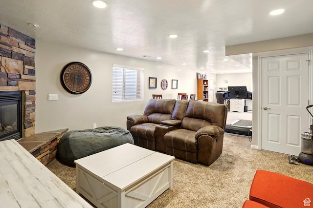 1424 W 3325 S, Perry, UT 84302 - living room featuring light carpet, a fireplace, and recessed lighting