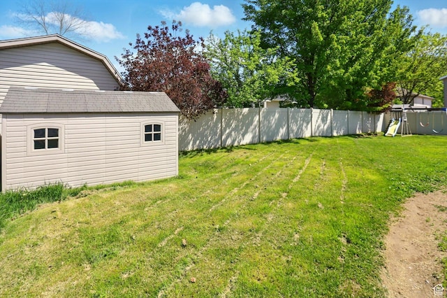 1424 W 3325 S, Perry, UT 84302 - view of yard with an outbuilding, a storage unit, and a playground