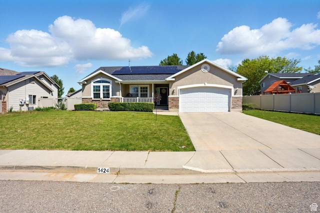 1424 W 3325 S, Perry, UT 84302 - view of front of house with a porch, a garage, roof mounted solar panels, driveway, and stucco siding