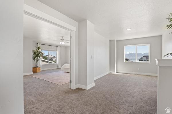 spare room with carpet floors and baseboards