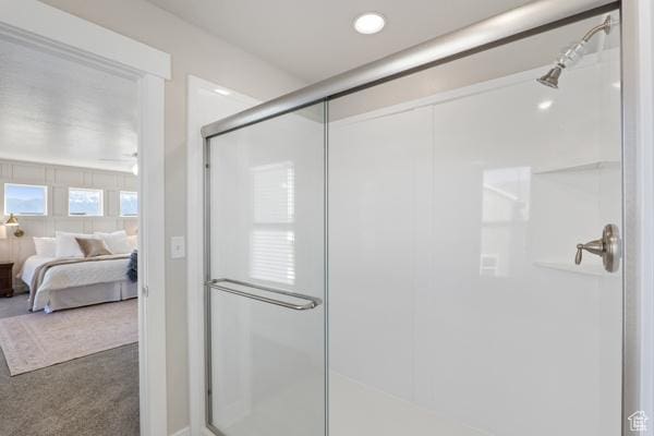 ensuite bathroom featuring a shower stall