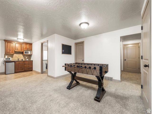 636 Quartz Dr, Santaquin, UT 84655 - game room featuring light carpet, a sink, a textured ceiling, and baseboards