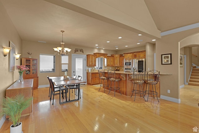 395 S 200 E, Willard, UT 84340 - dining space with arched walkways, stairway, light wood-type flooring, a chandelier, and recessed lighting