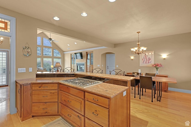 395 S 200 E, Willard, UT 84340 - kitchen with stainless steel gas cooktop, arched walkways, light stone counters, light wood finished floors, and recessed lighting