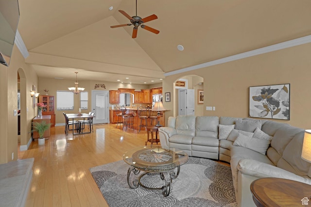 395 S 200 E, Willard, UT 84340 - living area featuring arched walkways, a chandelier, light wood-style flooring, high vaulted ceiling, and a ceiling fan