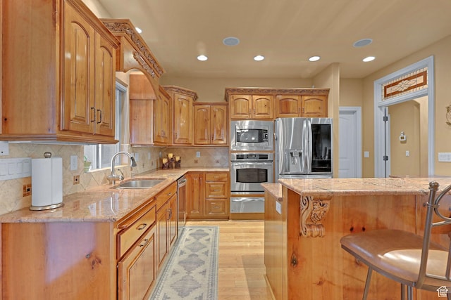 395 S 200 E, Willard, UT 84340 - kitchen featuring stainless steel appliances, a sink, light stone counters, recessed lighting, and a kitchen breakfast bar