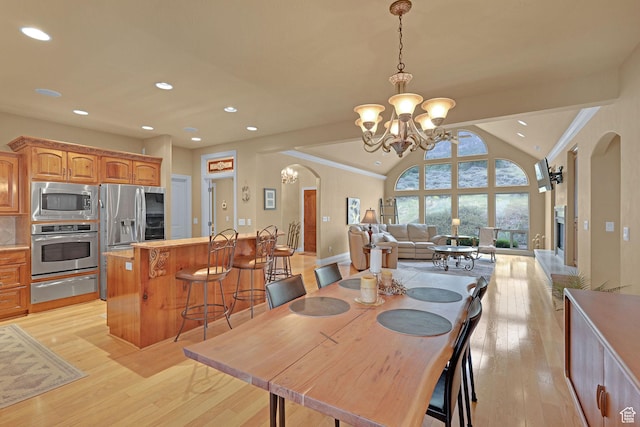 395 S 200 E, Willard, UT 84340 - dining space featuring a chandelier, arched walkways, vaulted ceiling, light wood-style floors, and recessed lighting
