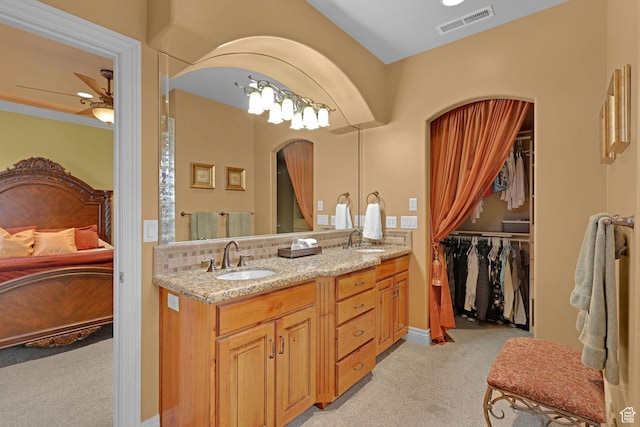395 S 200 E, Willard, UT 84340 - bathroom featuring ensuite bath, a ceiling fan, double vanity, decorative backsplash, and a walk in closet