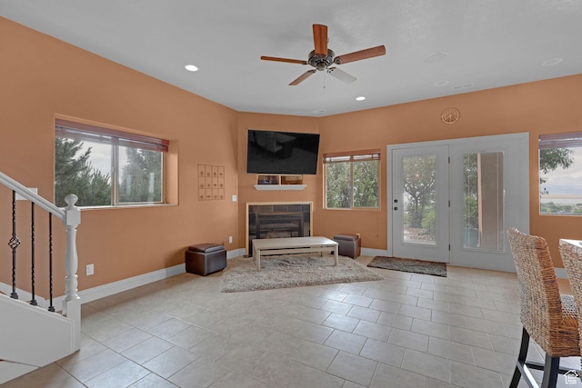 395 S 200 E, Willard, UT 84340 - unfurnished living room with a tiled fireplace, a ceiling fan, recessed lighting, baseboards, and stairway