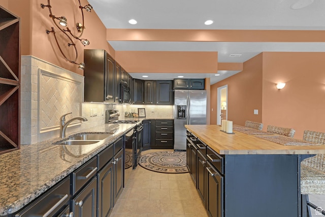 395 S 200 E, Willard, UT 84340 - kitchen with stainless steel refrigerator with ice dispenser, a sink, black microwave, butcher block countertops, and a breakfast bar