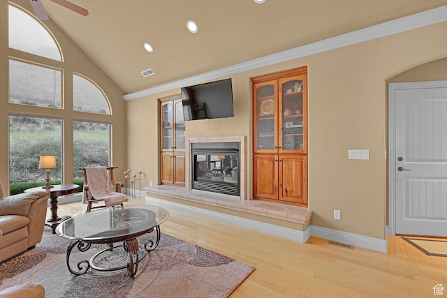 395 S 200 E, Willard, UT 84340 - living room featuring wood finished floors, a glass covered fireplace, recessed lighting, baseboards, and ornamental molding