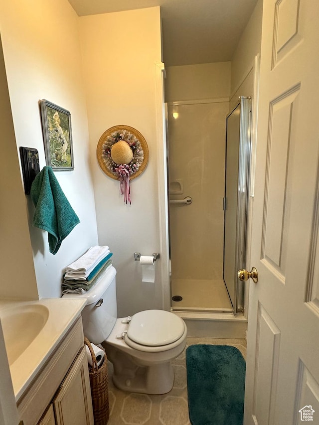 2756 S 725 W, Perry, UT 84302 - bathroom featuring a stall shower, toilet, vanity, and tile patterned flooring