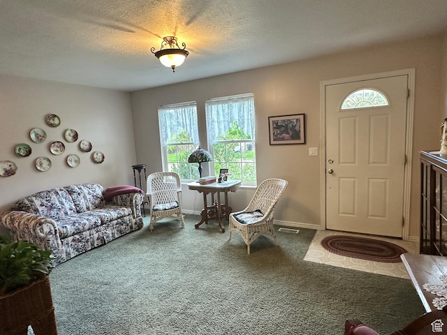 2756 S 725 W, Perry, UT 84302 - living area featuring plenty of natural light, carpet, baseboards, and a textured ceiling