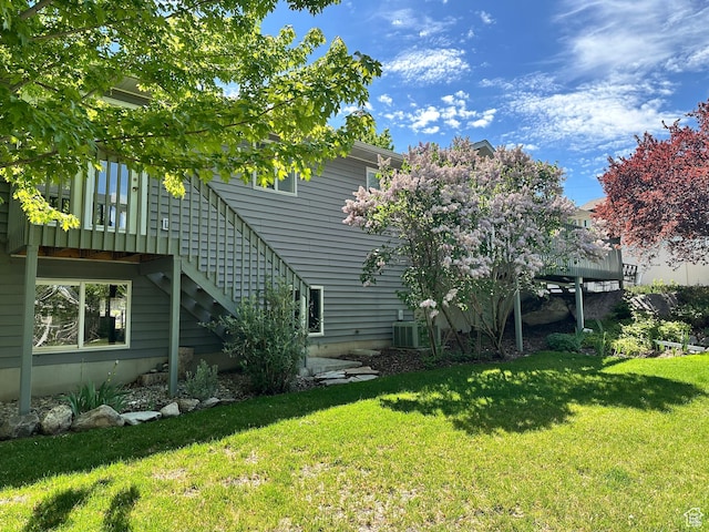 2756 S 725 W, Perry, UT 84302 - rear view of house featuring stairway, a yard, and central AC unit