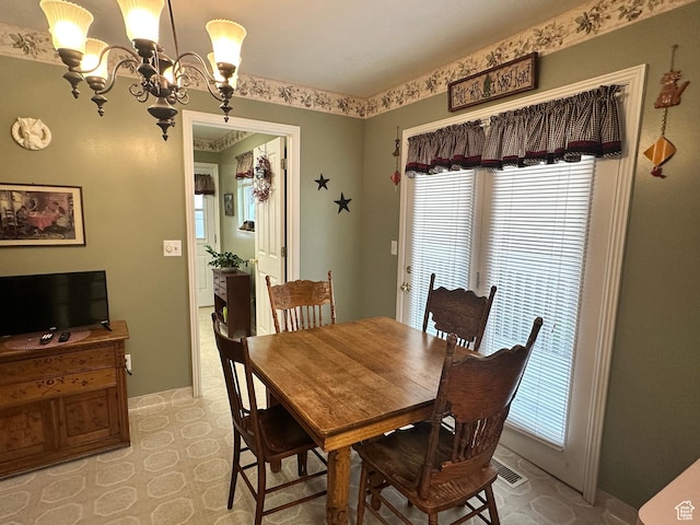2756 S 725 W, Perry, UT 84302 - dining space with a chandelier, baseboards, and light floors