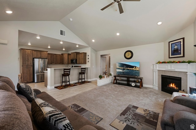 516 E Lone Star Ln Unit A, Saratoga Springs, UT 84045 - living area with ceiling fan, a tiled fireplace, recessed lighting, high vaulted ceiling, and baseboards