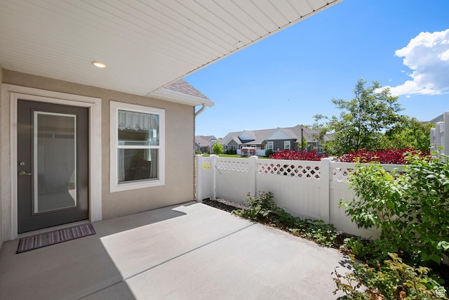 516 E Lone Star Ln Unit A, Saratoga Springs, UT 84045 - view of patio featuring a fenced backyard and a residential view