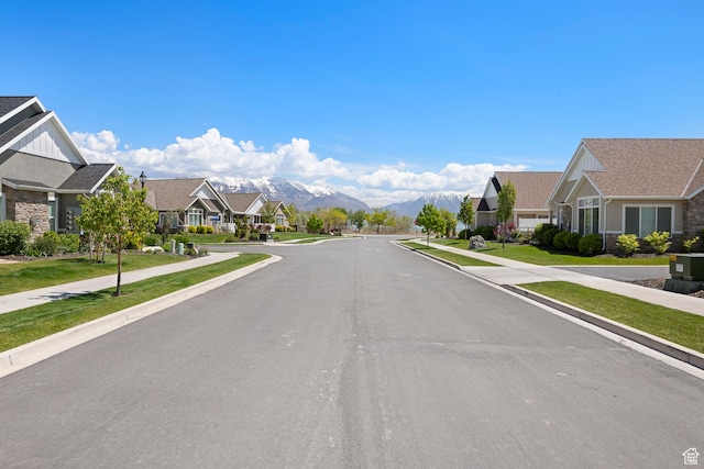 516 E Lone Star Ln Unit A, Saratoga Springs, UT 84045 - view of asphalt road with sidewalks, a residential view, a mountain view, and curbs