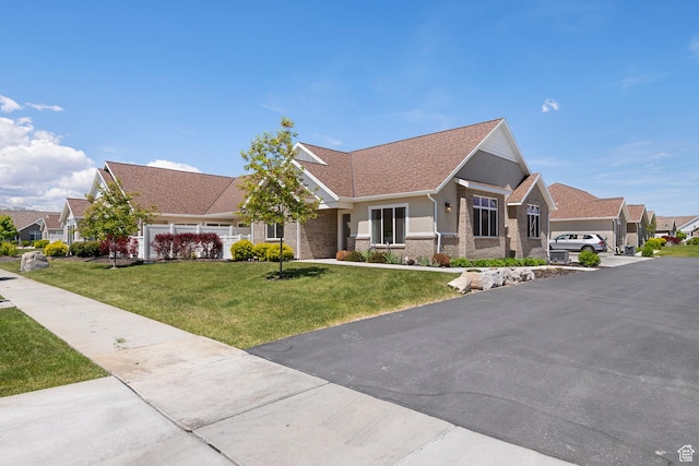 516 E Lone Star Ln Unit A, Saratoga Springs, UT 84045 - view of front of home with a front yard, a residential view, and a shingled roof