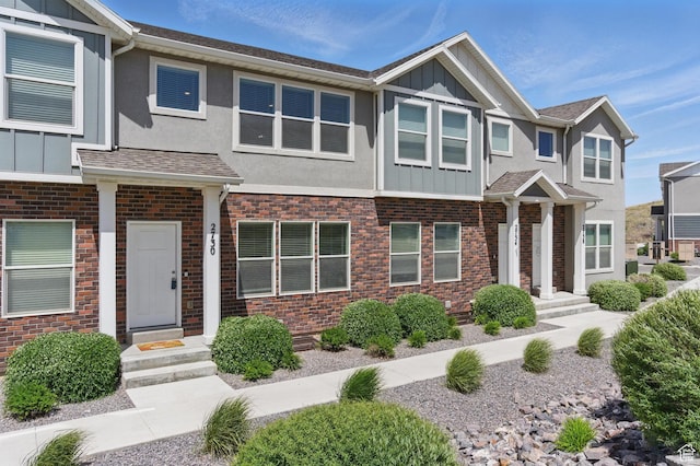 view of property featuring board and batten siding and stucco siding