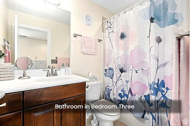 full bathroom with vanity, toilet, shower / bath combination with curtain, and tile patterned flooring