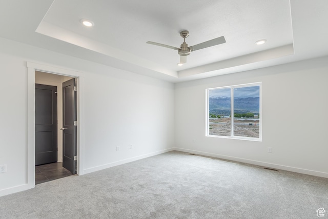 3148 N 2875 W Unit 29, Plain City, UT 84404 - carpeted spare room featuring a tray ceiling, a ceiling fan, baseboards, and recessed lighting