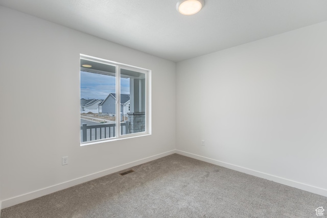 3148 N 2875 W Unit 29, Plain City, UT 84404 - unfurnished room with carpet floors and baseboards