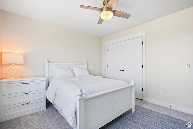bedroom featuring carpet floors, ceiling fan, and a closet