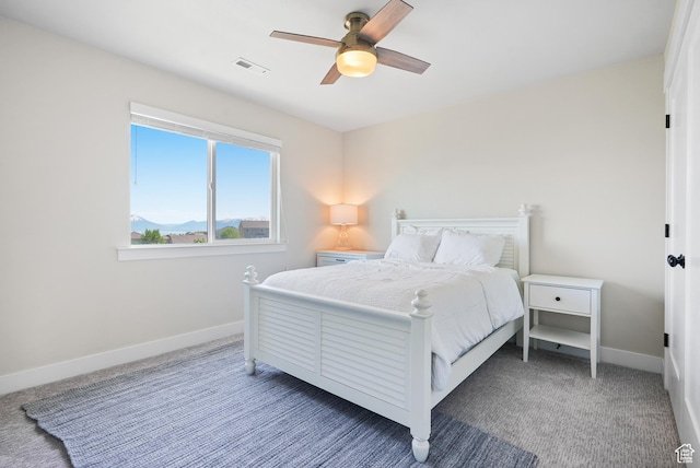 bedroom with baseboards, carpet, and a ceiling fan