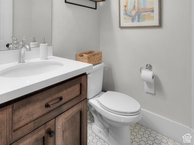 bathroom featuring toilet and vanity
